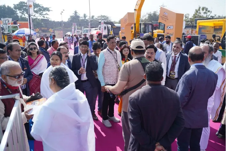 Visitors exploring machinery on the Odisha Mining Expo exhibition floor